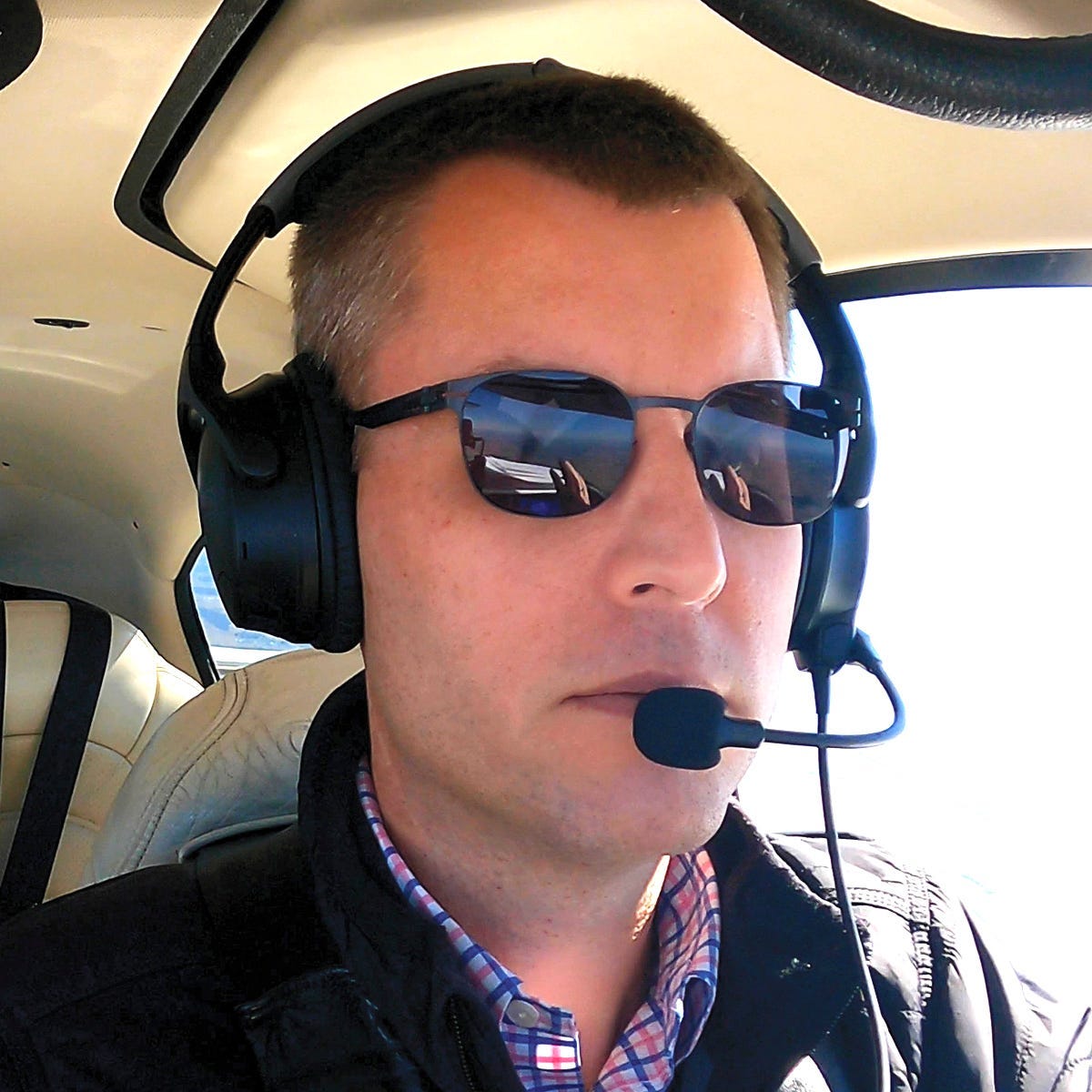John Zimmerman wearing Bose A30 headset while flying plane