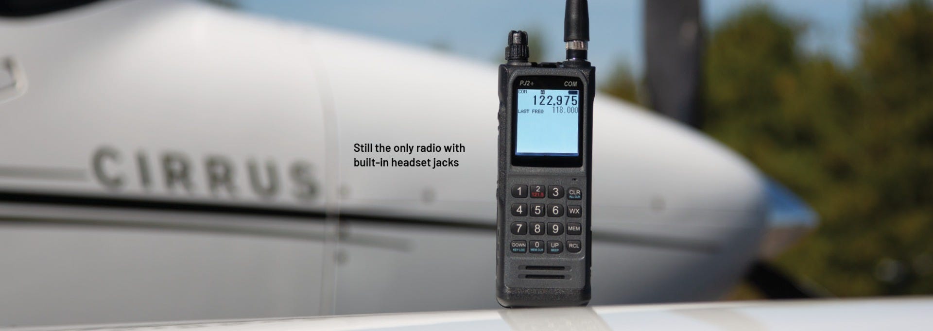 PJ2+ COM Radio displayed on wing of plane